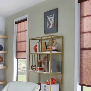 Brown solar shades covering bedroom windows